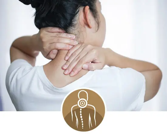 York Chiropractic Center | a worman with dark hair in a white t-shirt holding her neck in pain